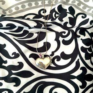 Sterling Silver hollow Heart Pendant (Silver toned chain included at no charge)